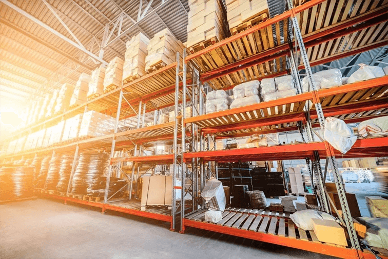 A warehouse with many shelves filled with boxes.