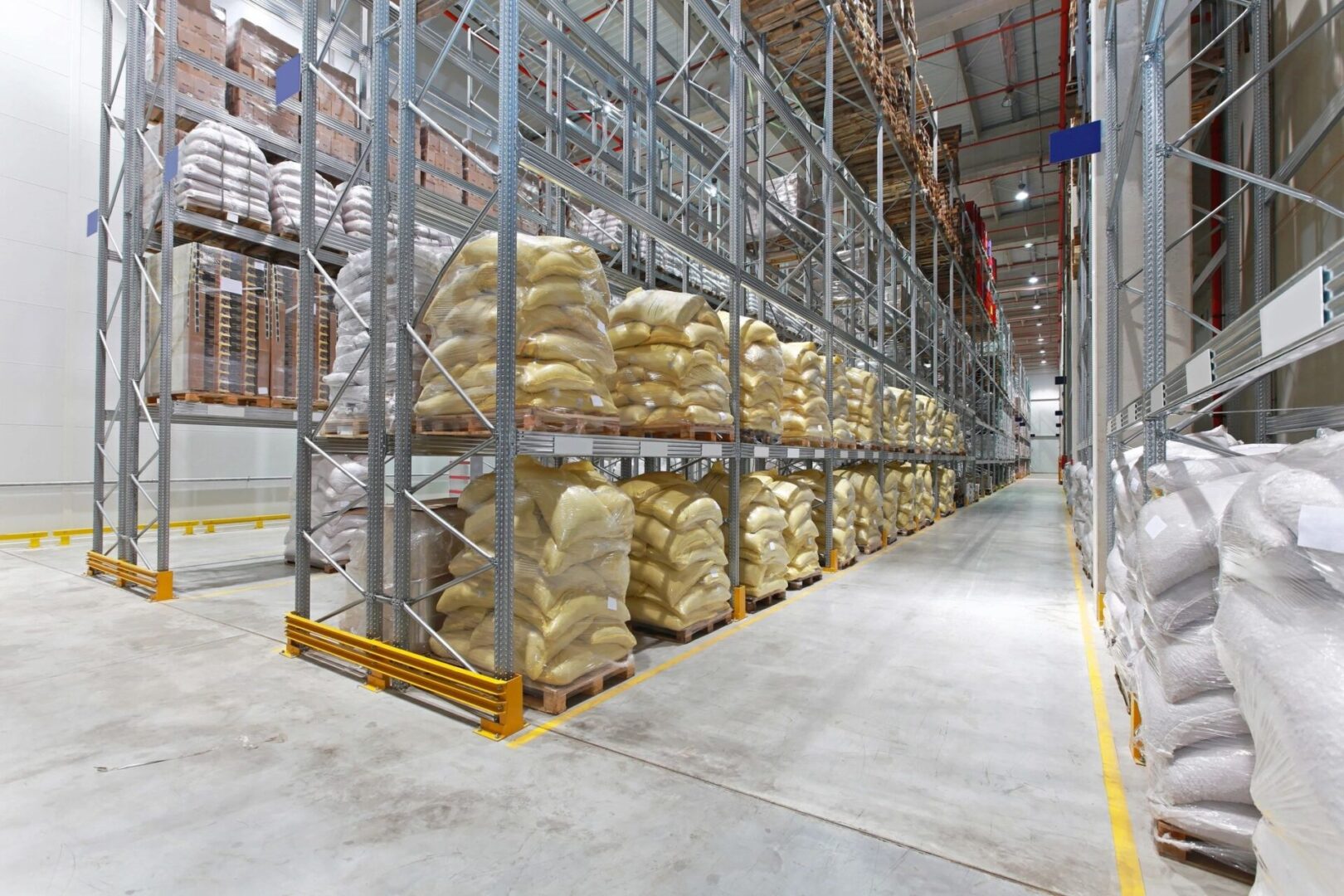 A warehouse filled with lots of bags of food.