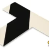 Black and white directional floor marking.