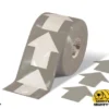 Grey floor tape with white arrows.