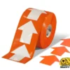 Orange roll of directional arrows tape.