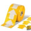 Yellow floor tape with white arrows.