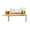 Shelf with fruit in clear containers.